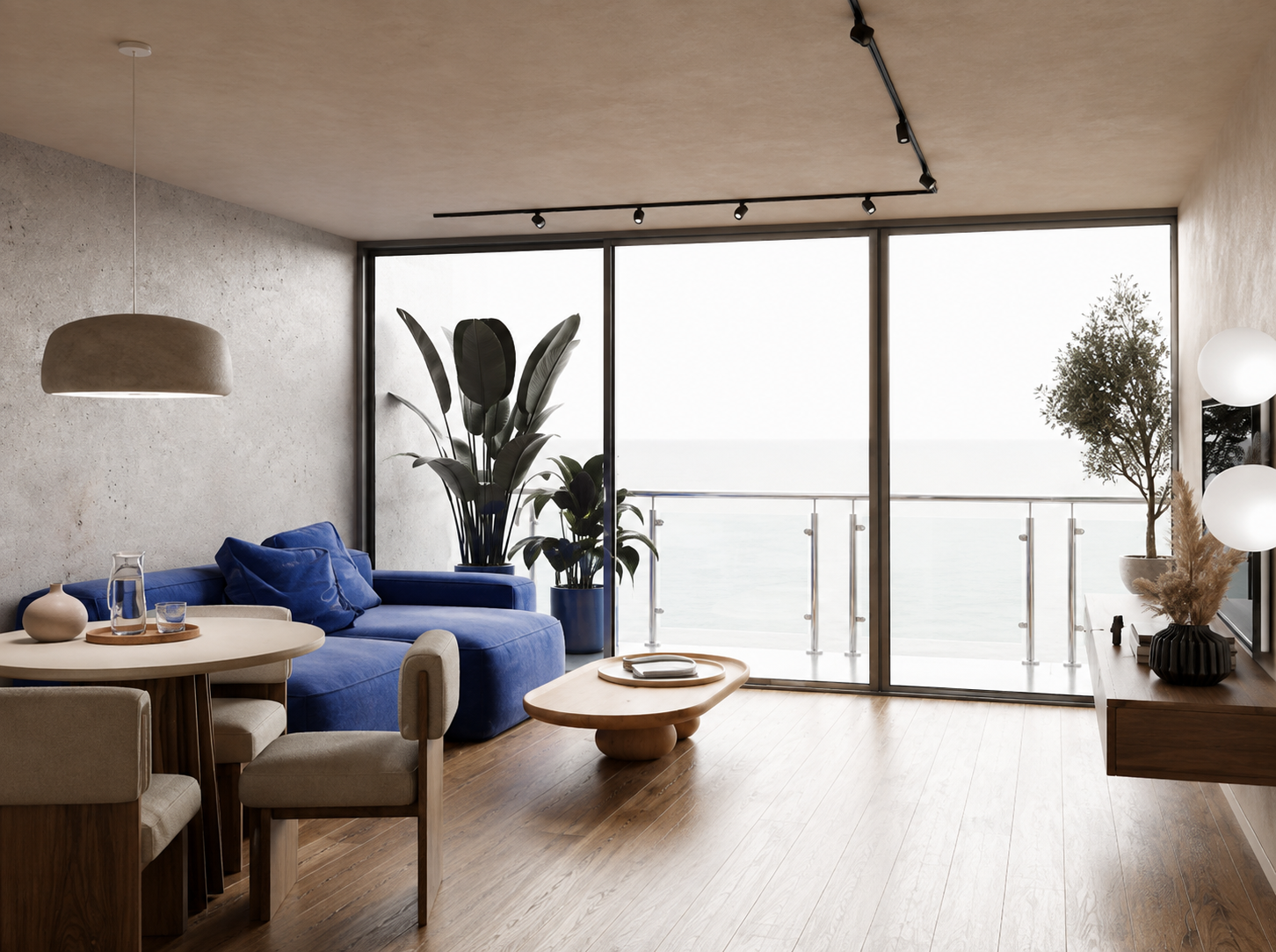 Sala com sofá azul e vão envidraçado sobre a varanda
