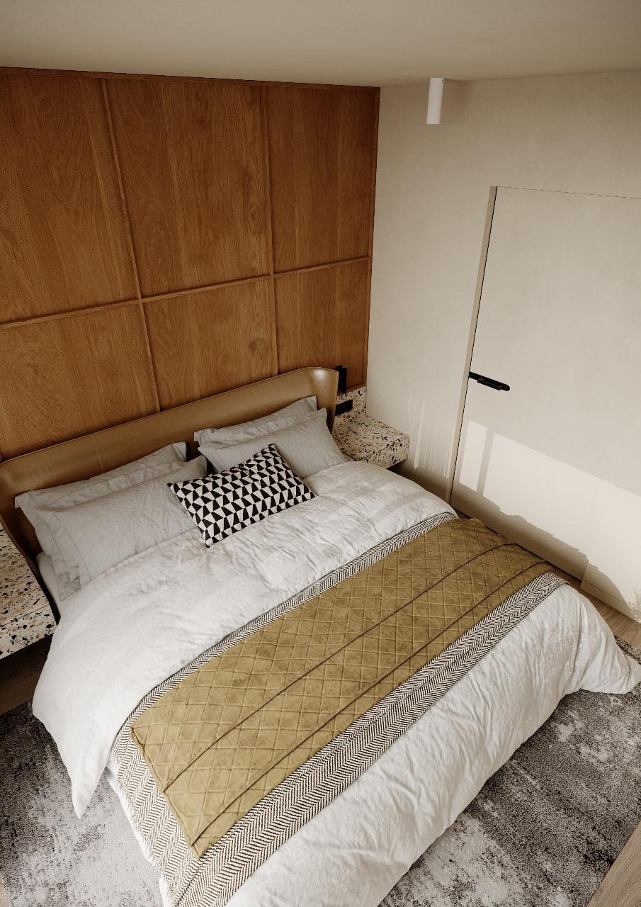 Quarto do T1, com cabeceira em painéis de madeira