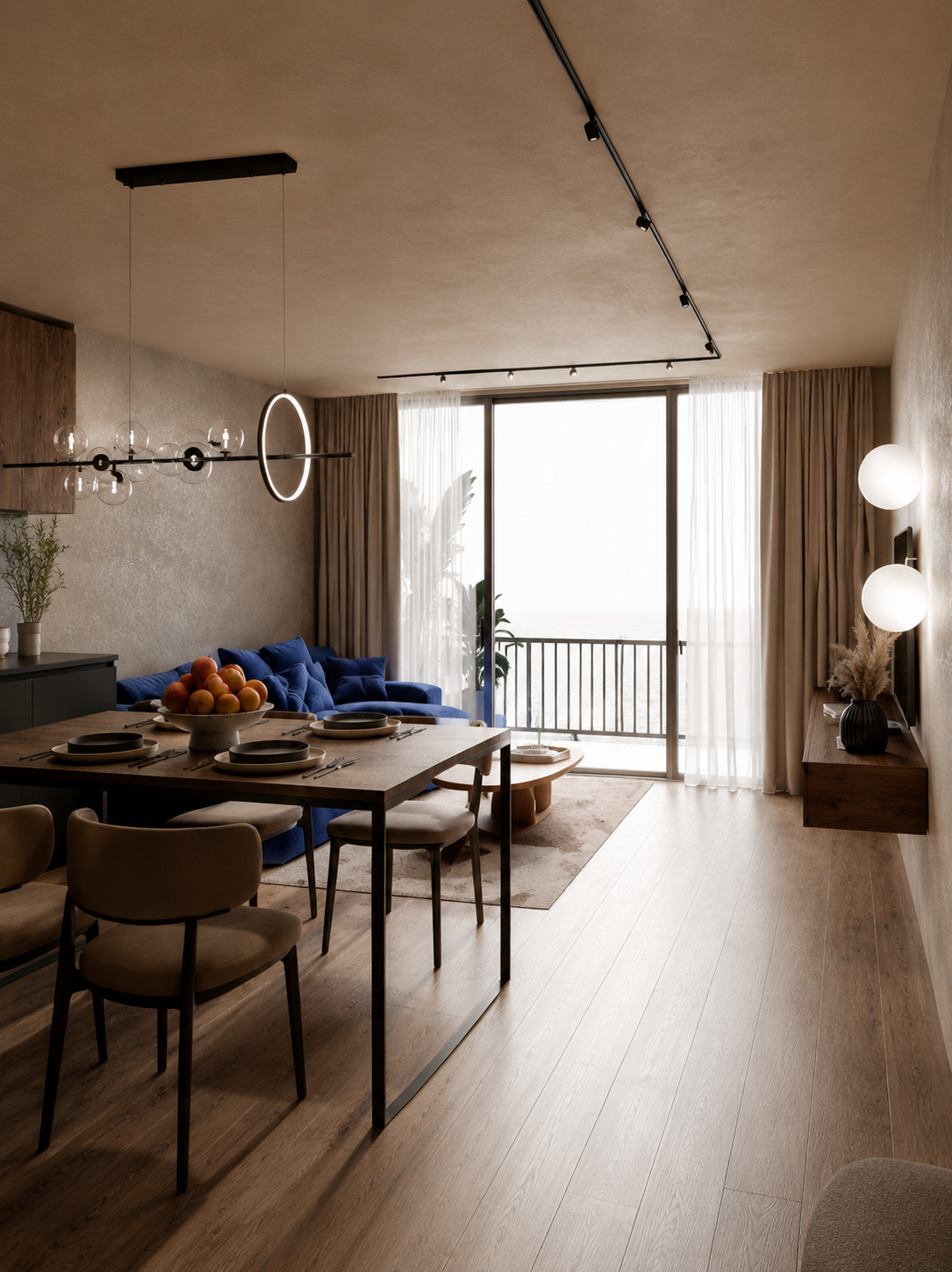 Sala e zona de refeições do T1, com sofá azul e vão para a varanda